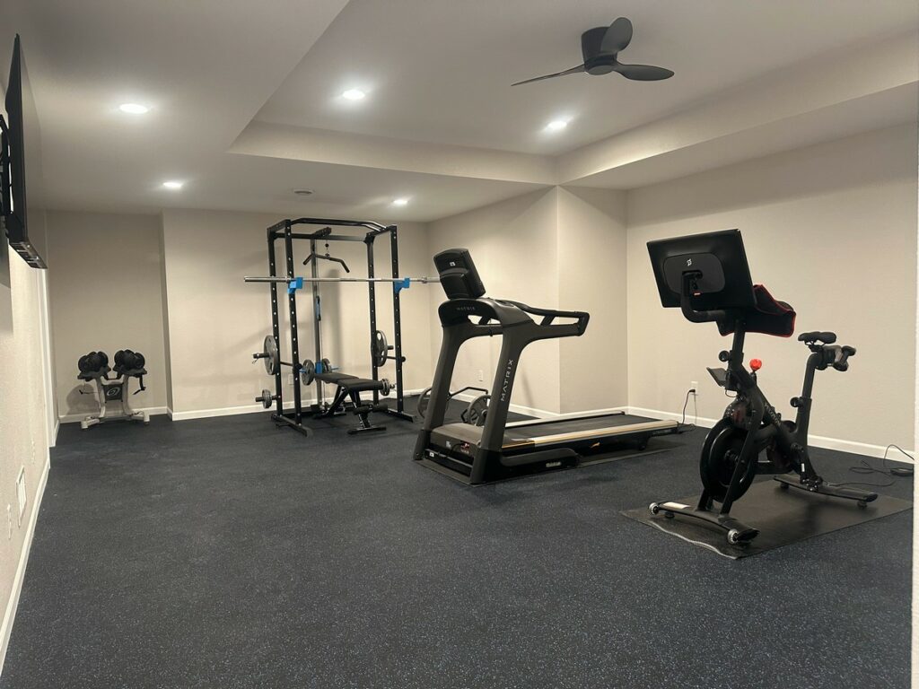Hartland Complete Basement Remodel: Custom Home Gym, Office & Entertainment Center