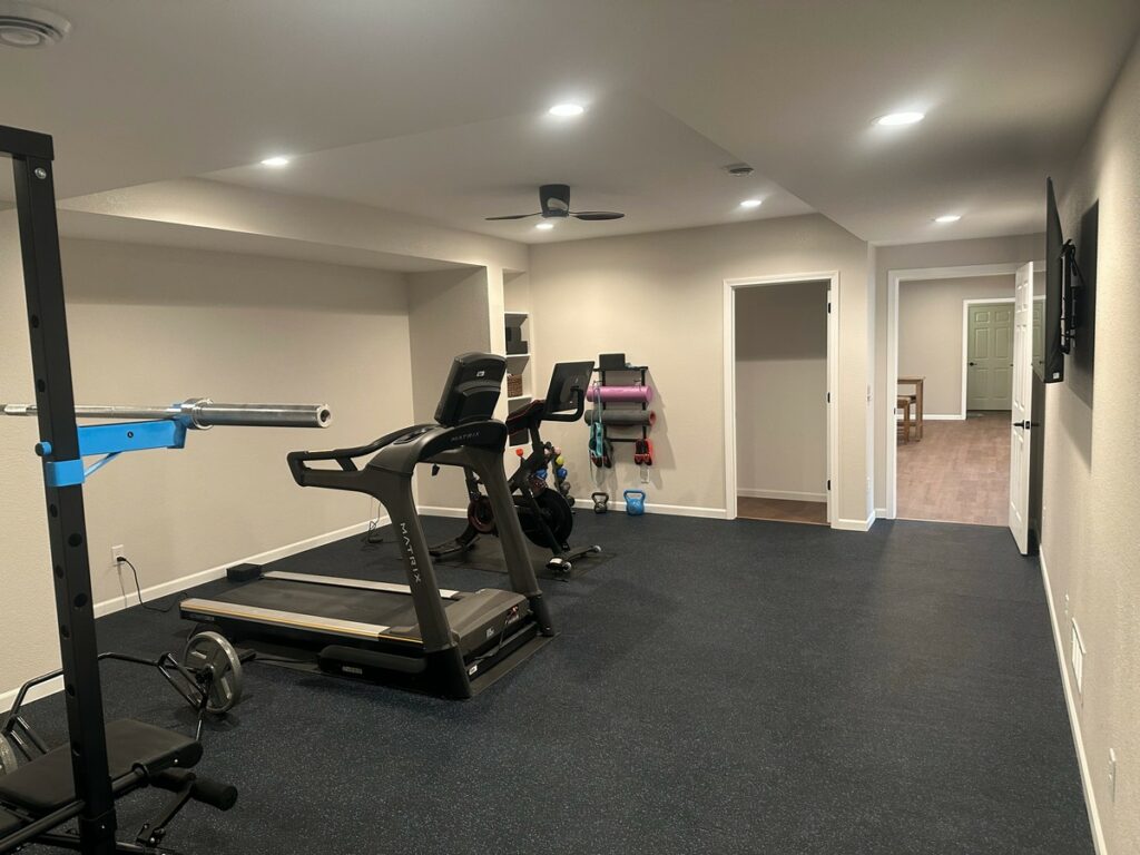 Hartland Complete Basement Remodel: Custom Home Gym, Office & Entertainment Center