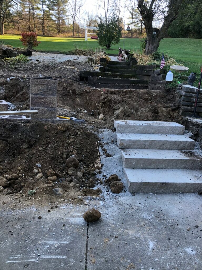 Pewaukee Two-Tier Retaining Wall & Stone Step Installation for Pool Deck
