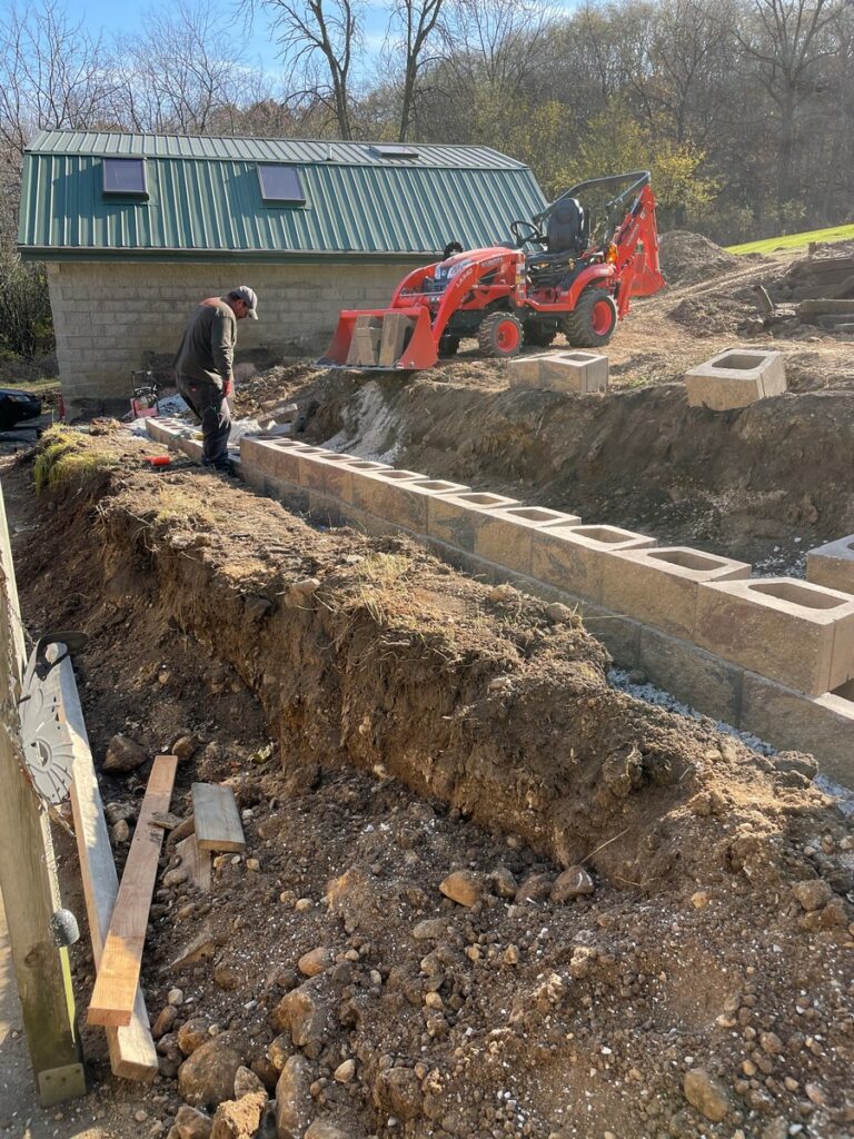 Pewaukee Two-Tier Retaining Wall & Stone Step Installation for Pool Deck