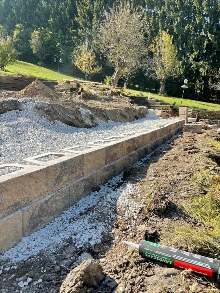 Pewaukee Two-Tier Retaining Wall & Stone Step Installation for Pool Deck