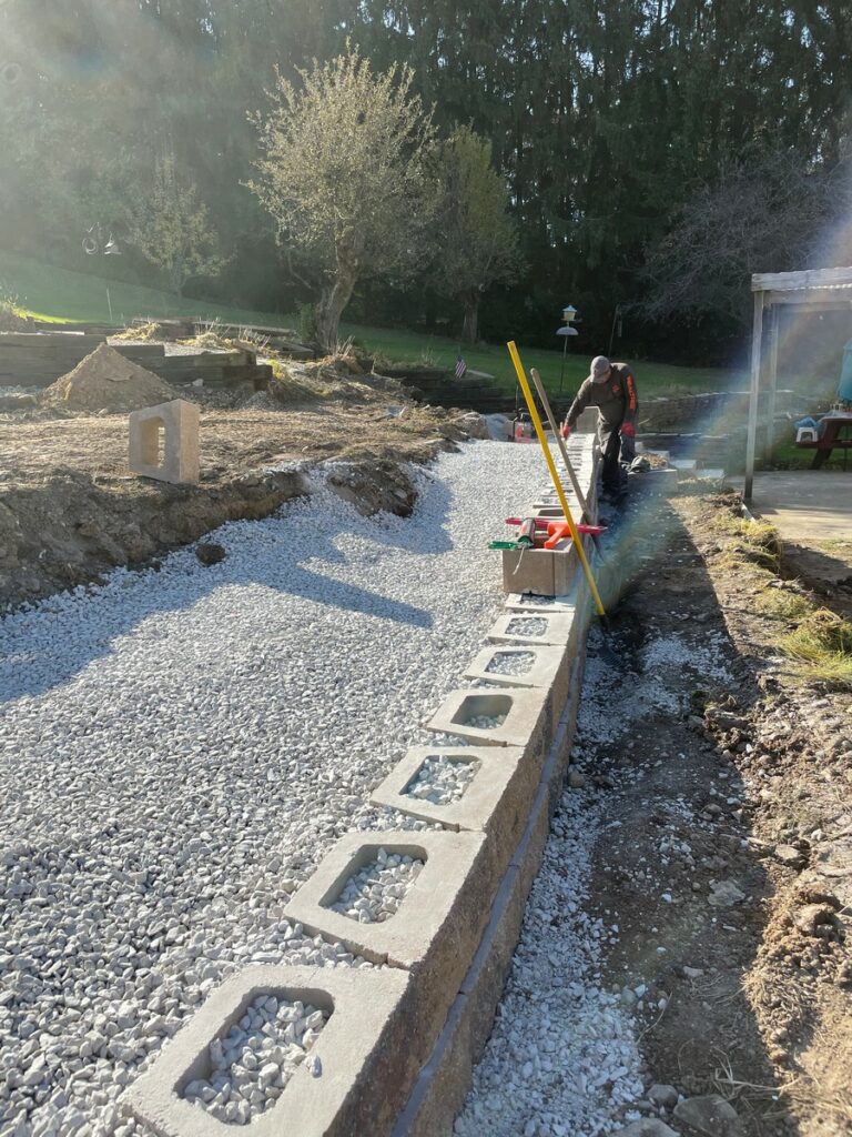 Pewaukee Two-Tier Retaining Wall & Stone Step Installation for Pool Deck