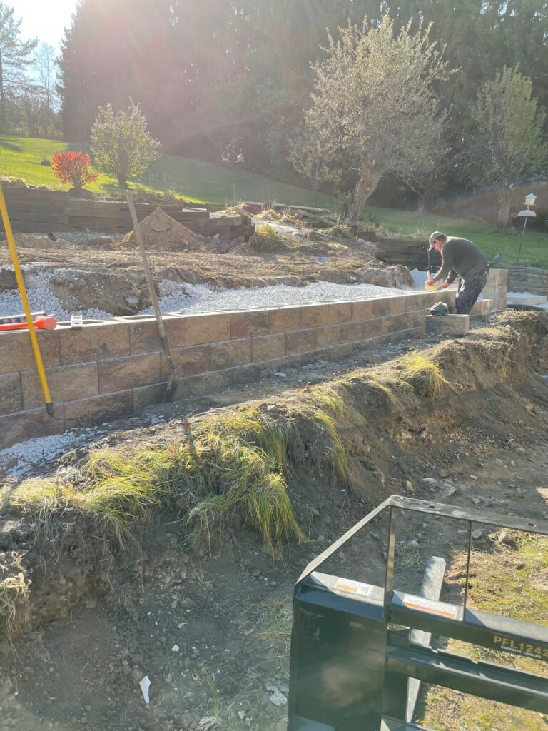 Pewaukee Two-Tier Retaining Wall & Stone Step Installation for Pool Deck