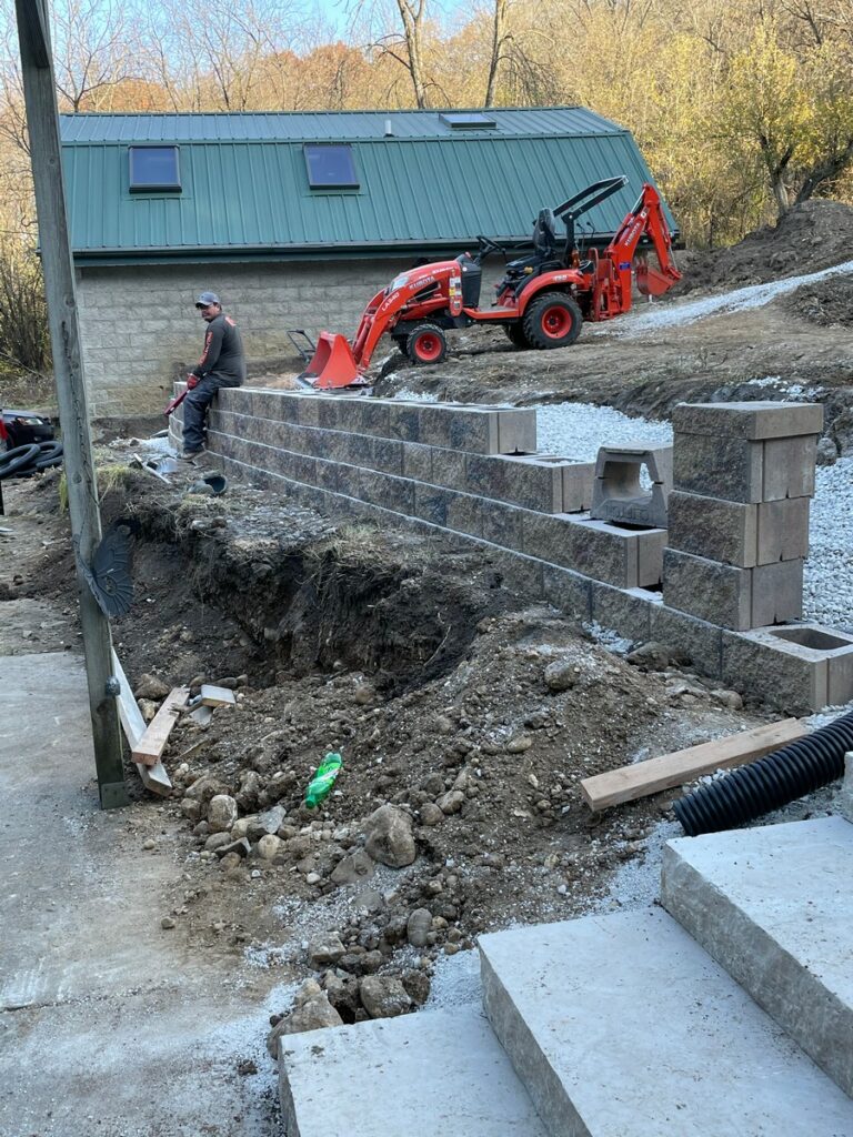 Pewaukee Two-Tier Retaining Wall & Stone Step Installation for Pool Deck