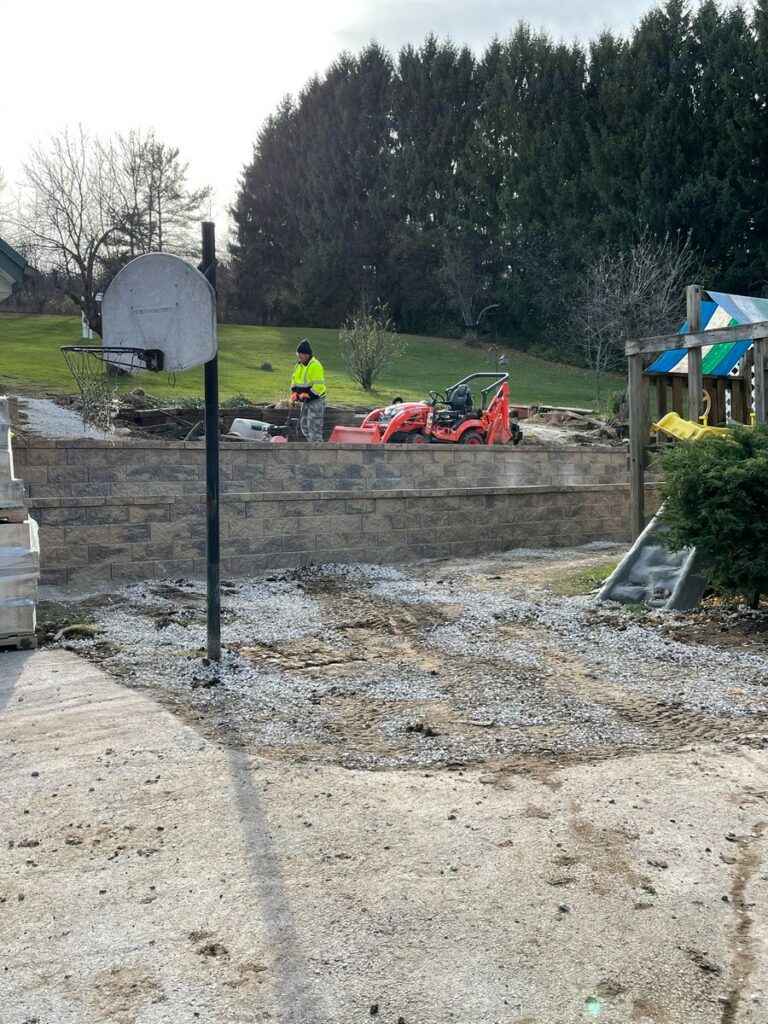 Pewaukee Two-Tier Retaining Wall & Stone Step Installation for Pool Deck