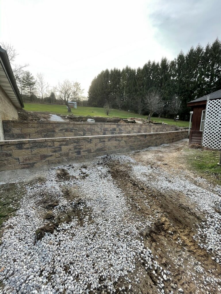 Pewaukee Two-Tier Retaining Wall & Stone Step Installation for Pool Deck