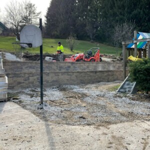 Pewaukee Two-Tier Retaining Wall & Stone Step Installation for Pool Deck